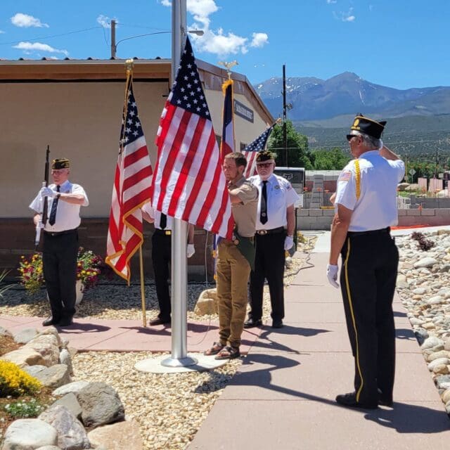 Eagle Scout Finn Blackburn Dedicates American Flags at Salida School District Buildings